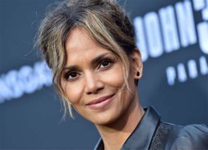 Halle Berry's Storm from X-Men: The Last Stand superimposed over The Marvels poster.