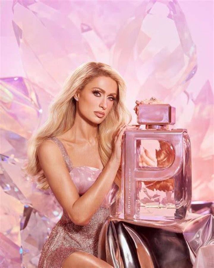 How does Paris Hilton boost Hilton Hotels' image in commercials?