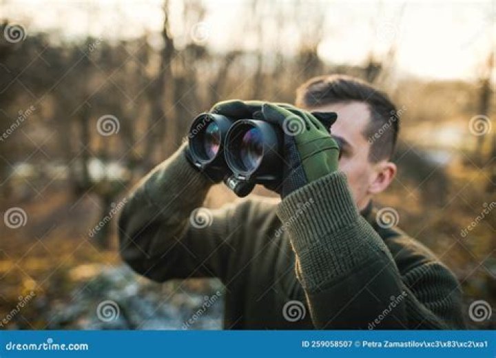Hunter looking down the radio tower in Fall (2022)