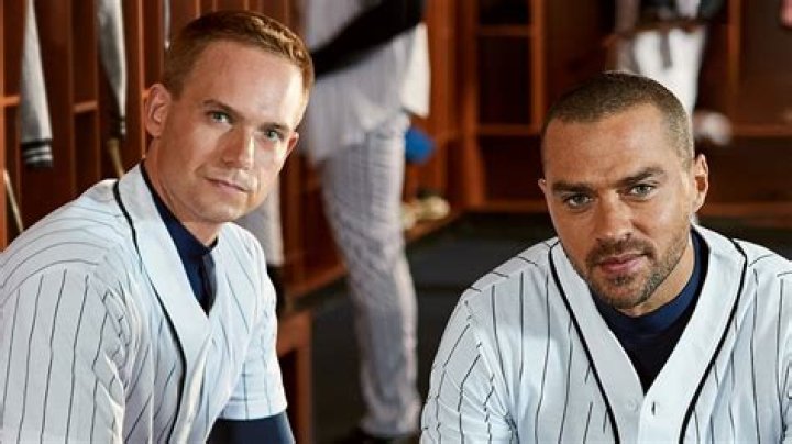 Patrick J. Adams and Jesse Williams are dressed like baseball players. 